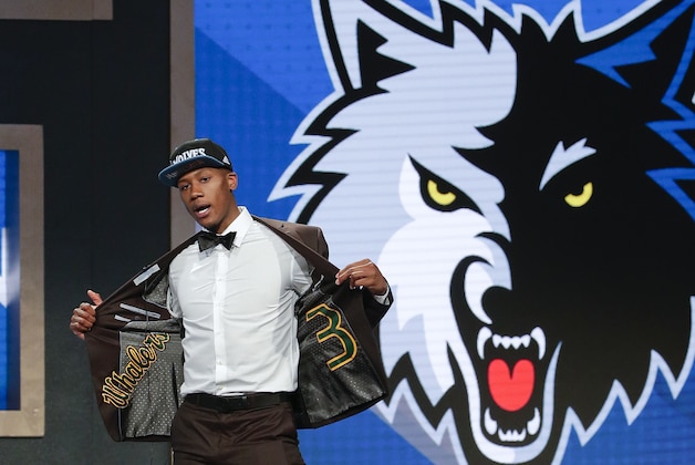 Kris Dunn reacts as he steps up on stage after being selected fifth overall by the Minnesota Timberwolves during the NBA basketball draft, Thursday, June 23, 2016, in New York. (AP Photo/Frank Franklin II)