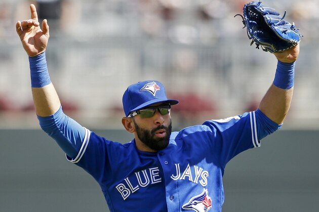 Toronto Blue Jays right fielder Jose Bautista celebrates a win over the Minnesota Twins at a baseball game Sunday, May 22, 2016, in Minneapolis. (AP Photo/Bruce Kluckhohn)