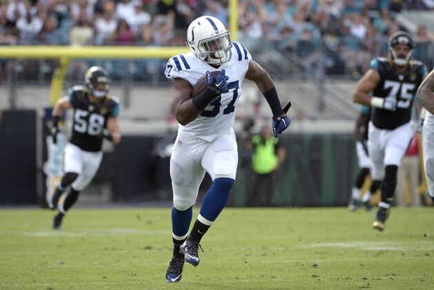 Indianapolis Colts running back Zurlon Tipton (37) rushes for yardage during the first half of an NFL football game against the Jacksonville Jaguars in Jacksonville, Fla., Sunday, Dec. 13, 2015. (AP Photo/Phelan M. Ebenhack)