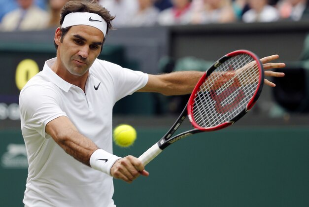 Roger Federer of Switzerland returns to Guido Pella of Argentina during their men's singles match on day one of the Wimbledon Tennis Championships in London, Monday, June 27, 2016. (AP Photo/Alastair Grant)