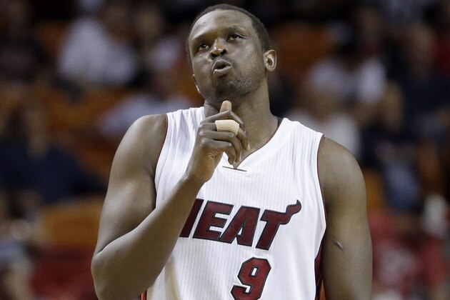 Miami Heat forward Luol Deng (9) walks on the court in the second half of an NBA basketball game against the Chicago Bulls, Thursday, April 7, 2016, in Miami. (AP Photo/Alan Diaz)