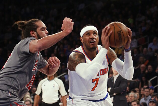 New York Knicks' Carmelo Anthony (7) drives to the basket against Chicago Bulls' Joakim Noah, left, during the first half of an NBA basketball game Saturday, Dec. 19, 2015, in New York. (AP Photo/Jason DeCrow)