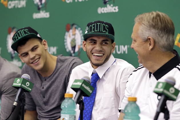Boston Celtics  basketball draft picks Ante Zizic, left, of Croatia, and Abdel Nader, center, of Egypt, laugh with Danny Ainge, Celtics president of basketball operations, during an introductory news conference Friday, June 24, 2016, in Waltham, Mass. (AP Photo/Elise Amendola)