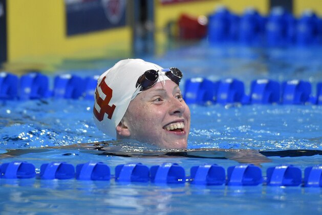 Lilly King smiles after a women's 100-meter breaststroke semifinal at the U.S. Olympic swimming trials in Omaha, Neb., Monday, June 27, 2016. (AP Photo/Mark J. Terrill)