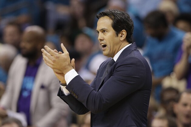 Miami Heat head coach Erik Spoelstra applauds his team against the Charlotte Hornets during the first half in Game 6 of an NBA basketball playoffs first-round series in Charlotte, N.C., Friday, April 29, 2016. (AP Photo/Chuck Burton)