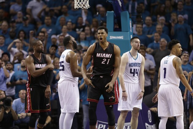 Miami Heat's Hassan Whiteside (21) reacts after making a basket and being fouled by Charlotte Hornets' Frank Kaminsky III (44) during the second half in Game 6 of an NBA basketball playoffs first-round series in Charlotte, N.C., Friday, April 29, 2016. The Heat won 97-90. (AP Photo/Chuck Burton)