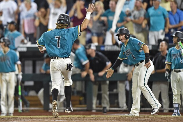 OMAHA, NE - JUNE 28:  Base runner Zach Remillard #7 of the Coastal Carolina Chanticleers reacts as he scores against the Arizona Wildcats in the seventh inning during game two of the College World Series Championship Series on June 28, 2016 at TD Ameritrade Park in Omaha, Nebraska.  The Chanticleers won 5-4. (Photo by Peter Aiken/Getty Images)