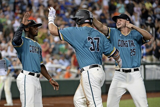 Jun 28, 2016; Omaha, NE, USA; Coastal Carolina Chanticleers designated hitter G.K. Young (37) celebrates with pitcher Mike Morrison (25) during the eighth inning against the Arizona Wildcats in game two of the College World Series championship series at TD Ameritrade Park. Mandatory Credit: Steven Branscombe-USA TODAY Sports