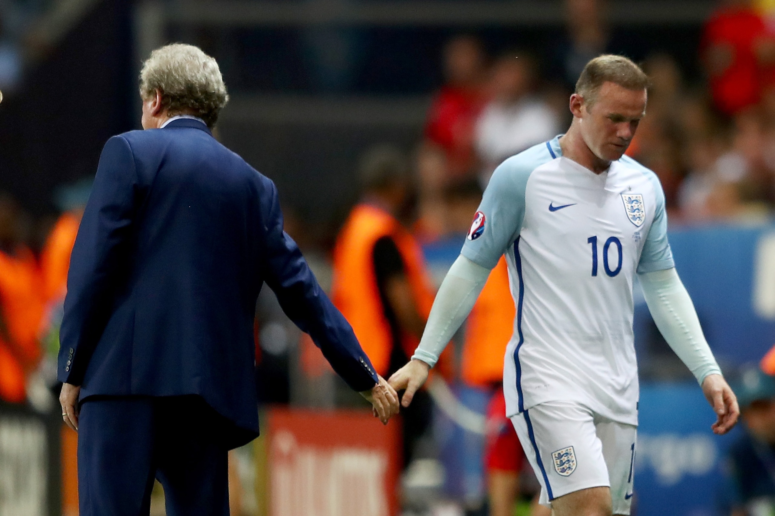 NICE, FRANCE - JUNE 27:  Wayne Rooney of England shakes hands with Roy Hodgson manager of England after being replaced during the UEFA EURO 2016 round of 16 match between England and Iceland at Allianz Riviera Stadium on June 27, 2016 in Nice, France. (Photo by Lars Baron/Getty Images)