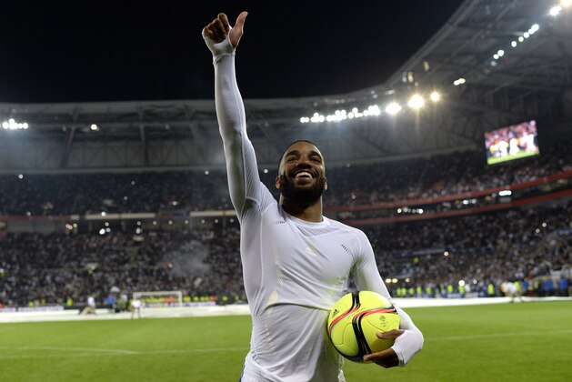 Lyon's French forward Alexandre Lacazette  (L) jubilates at the end of the French L1 football match between Lyon (OL) and Monaco (ASM) at the Parc de l'Olympique Lyonnais in Decines-Charpieu, central eastern France, on May 7, 2016. / AFP / ROMAIN LAFABREGUE        (Photo credit should read ROMAIN LAFABREGUE/AFP/Getty Images)