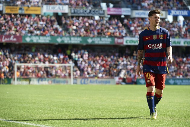 GRANADA, SPAIN - MAY 14:  Lionel Messi of FC Barcelona walks on the pitch during the La Liga match between Granada CF and FC Barcelona at Estadio Nuevo Los Carmenes on May 14, 2016 in Granada, Spain.  (Photo by Manuel Queimadelos Alonso/Getty Images)
