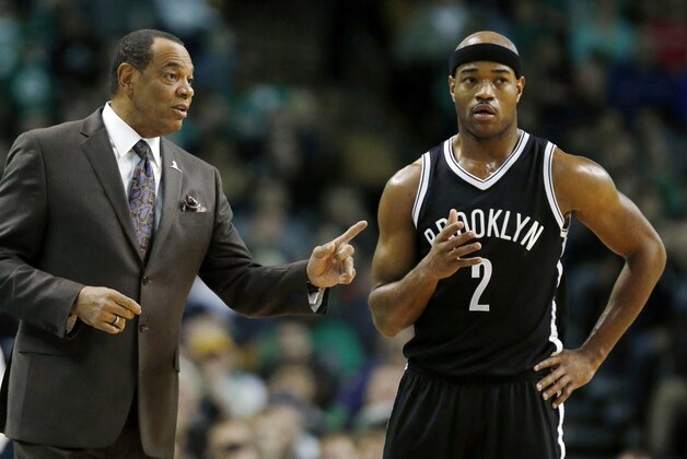 Brooklyn Nets head coach Lionel Hollins talks with Jarrett Jack (2) during the first quarter of an NBA basketball game in Boston, Saturday, Jan. 2, 2016. (AP Photo/Michael Dwyer)