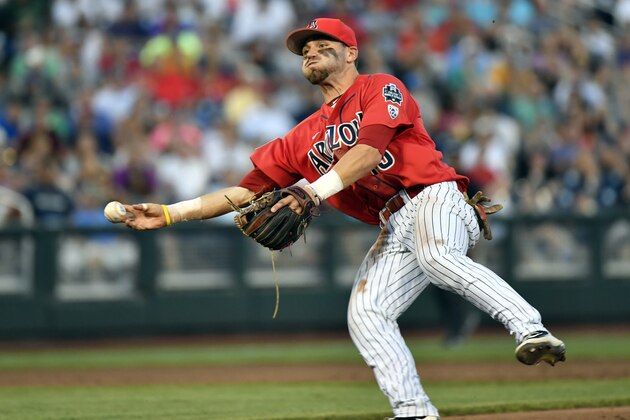 Arizona second baseman Cody Ramer (13) throws to first after fielding a single by Coastal Carolina's Anthony Marks in the  fifth inning in Game 2 of the NCAA Men's College World Series finals baseball game in Omaha, Neb., Tuesday, June 28, 2016. (AP Photo/Ted Kirk)