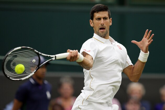 Novak Djokovic of Serbia returns to Adrian Mannarino of France during their men's singles match on day three of the Wimbledon Tennis Championships in London, Wednesday, June 29, 2016. (AP Photo/Tim Ireland)