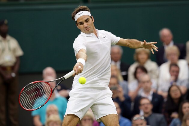 Roger Federer of Switzerland plays a return to Marcus Willis of Britain during their women's singles match on day three of the Wimbledon Tennis Championships in London, Wednesday, June 29, 2016. (AP Photo/Tim Ireland)