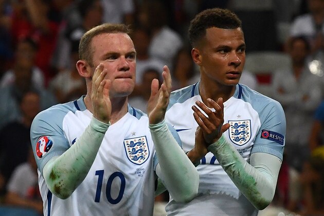 England's forward Wayne Rooney (L) and England's forward Marcus Rashford react after the Euro 2016 round of 16 football match between England and Iceland at the Allianz Riviera stadium in Nice on June 27, 2016. / AFP / ANNE-CHRISTINE POUJOULAT        (Photo credit should read ANNE-CHRISTINE POUJOULAT/AFP/Getty Images)