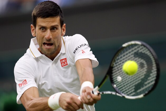 Novak Djokovic of Serbia returns to Adrian Mannarino of France during their men's singles match on day three of the Wimbledon Tennis Championships in London, Wednesday, June 29, 2016. (AP Photo/Tim Ireland)