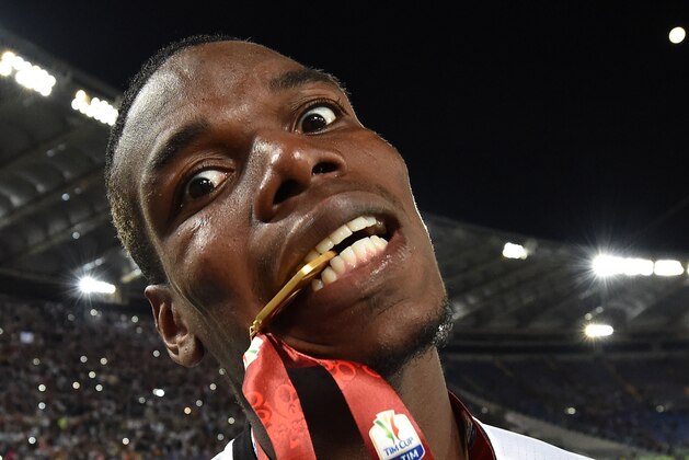 ROME, ITALY - MAY 21:  Paul Pogba of Juventus FC celebrates the victory after the TIM Cup match between AC Milan and Juventus FC at Stadio Olimpico on May 21, 2016 in Rome, Italy.  (Photo by Giuseppe Bellini/Getty Images)
