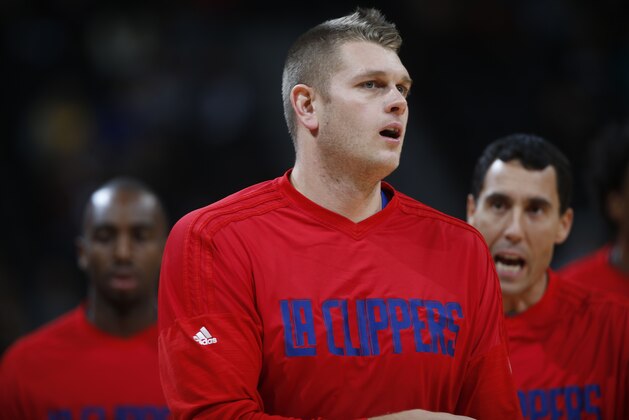 Los Angeles Clippers center Cole Aldrich (45) warms up before facing the Denver Nuggets in the first half of an NBA basketball game Tuesday, Nov. 24, 2015, in Denver. (AP Photo/David Zalubowski)