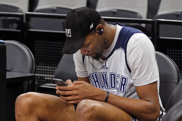 SAN ANTONIO, TX - MAY 10:  Kevin Durant #35 of the Oklahoma City Thunder texts on his phone during a practice before Game Five of the NBA Western Conference Semi-finals against the San Antonio Spurs on May 10, 2016 at the AT&T Center in San Antonio, Texas. NOTE TO USER: User expressly acknowledges and agrees that, by downloading and or using this Photograph, user is consenting to the terms and conditions of the Getty Images License Agreement. Mandatory Copyright Notice: Copyright 2016 NBAE (Photo by Layne Murdoch/NBAE via Getty Images)