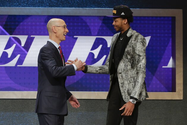 NBA Commissioner Adam Silver greets Brandon Ingram after Ingram was selected as the second pick overall by the Los Angeles Lakers during the NBA basketball draft, Thursday, June 23, 2016, in New York. (AP Photo/Frank Franklin II)