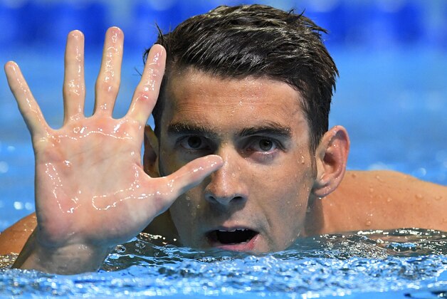Michael Phelps gestures after winning the men's 200-meter butterfly at the U.S. Olympic swimming trials, Wednesday, June 29, 2016, in Omaha, Neb. (AP Photo/Mark J. Terrill)