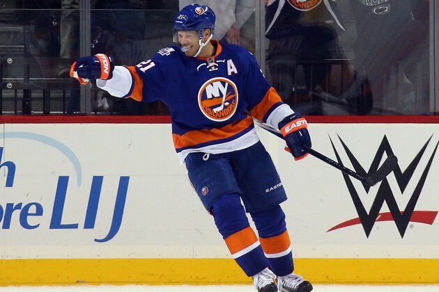 NEW YORK, NY - OCTOBER 26: Kyle Okposo #21 of the New York Islanders celebrates his goal against the Calgary Flames at the Barclays Center on October 26, 2015 in the Brooklyn borough of New York City. The Islanders shut out the Flames 4-0.  (Photo by Bruce Bennett/Getty Images)
