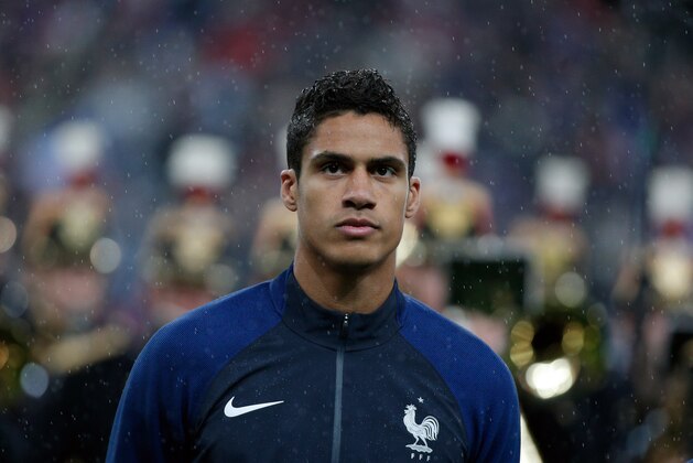 France's Raphael Varane sings his national anthem prior to the international friendly soccer match between France and Russia in Saint Denis, north of Paris, France, Tuesday, March 29, 2016. (AP Photo/Thibault Camus)