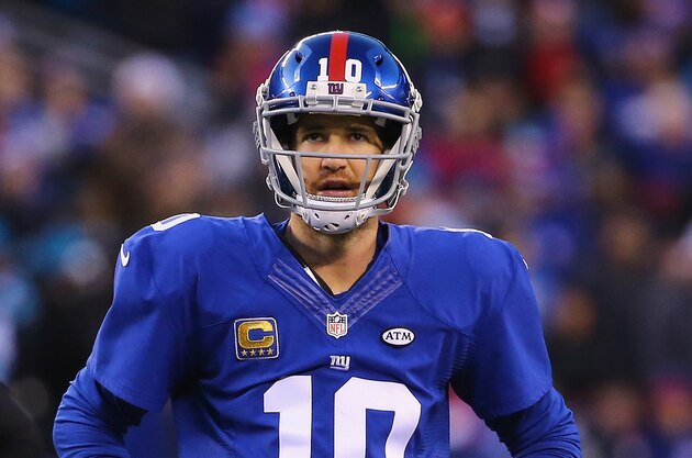 EAST RUTHERFORD, NJ - DECEMBER 20:  Eli Manning #10 of the New York Giants looks on against the Carolina Panthers  during their game at MetLife Stadium on December 20, 2015 in East Rutherford, New Jersey.  (Photo by Al Bello/Getty Images)