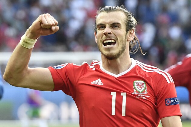 Wales’s Gareth Bale celebrates winning the Euro 2016 round of 16 soccer match between Wales and Northern Ireland, at the Parc des Princes stadium in Paris, Saturday, June 25, 2016. (AP Photo/Martin Meissner)