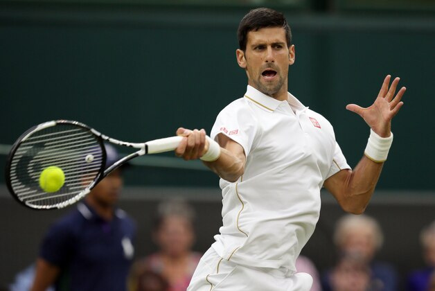 Novak Djokovic of Serbia returns to Adrian Mannarino of France during their men's singles match on day three of the Wimbledon Tennis Championships in London, Wednesday, June 29, 2016. (AP Photo/Tim Ireland)