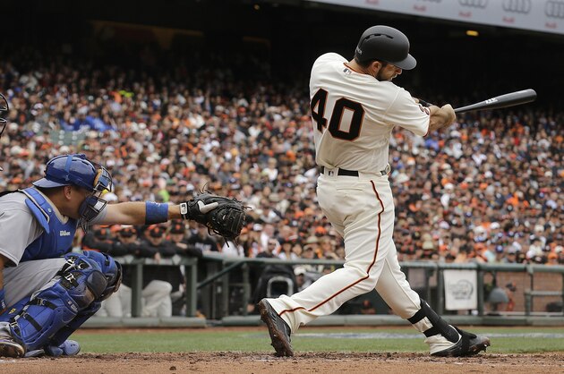 FILE - In this April 9, 2016, file photo, San Francisco Giants' Madison Bumgarner (40) hits a solo home run in front of Los Angeles Dodgers catcher A.J. Ellis during the second inning of a baseball game in San Francisco. San Francisco manager Bruce Bochy said he plans to use his slugging pitcher Bumgarner instead of a designated hitter Thursday, June 30, 2016, night when the Giants visit the Oakland Athletics. (AP Photo/Jeff Chiu, File) FILE - In this April 9, 2016, file photo, San Francisco Giants' Madison Bumgarner (40) hits a solo home run in front of Los Angeles Dodgers catcher A.J. Ellis during the second inning of a baseball game in San Francisco. San Francisco manager Bruce Bochy said he plans to use his slugging pitcher Bumgarner instead of a designated hitter Thursday, June 30, 2016, night when the Giants visit the Oakland Athletics. (AP Photo/Jeff Chiu, File)