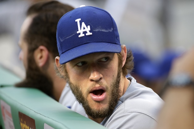 Los Angeles Dodgers starting pitcher Clayton Kershaw stands in the dugout before a baseball game against the Pittsburgh Pirates in Pittsburgh, Saturday, June 25, 2016. (AP Photo/Gene J. Puskar)