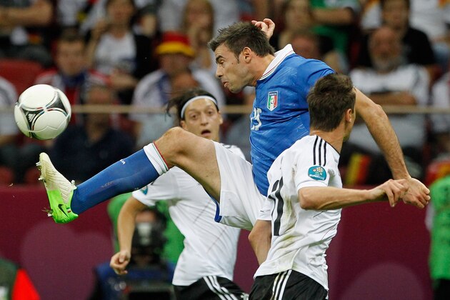 WARSAW, POLAND - JUNE 28:  Andrea Barzagli of Italy (C) fights for the ball with Mesut Oezil (L) and Miroslav Klose (R) of Germany during the UEFA EURO 2012 semi final match between Germany and Italy at the National Stadium on June 28, 2012 in Warsaw, Poland.  (Photo by Boris Streubel/Getty Images)