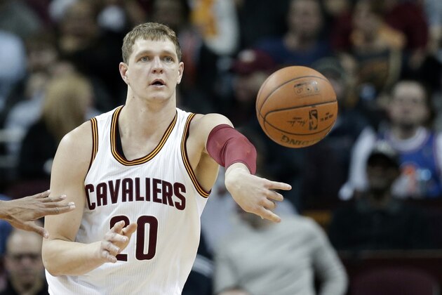 Cleveland Cavaliers' Timofey Mozgov, from Russia, passes against the Indiana Pacers in the first half of an NBA basketball game Monday, Feb. 29, 2016, in Cleveland. (AP Photo/Tony Dejak)