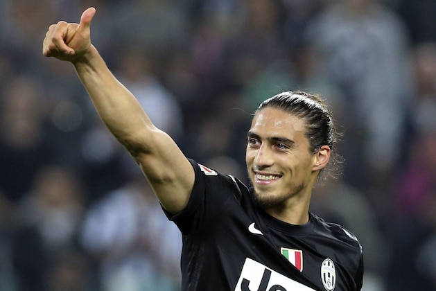 Juventus defender Martin Caceres, of Uruguay, gives the thumb-up sign at the end of a Serie A soccer match between Juventus and Napoli, at the Juventus stadium in Turin, Italy, Saturday, Oct. 20, 2012. Defending champion Juventus got two late goals from substitutes in a 2-0 win over Napoli in a top-of-the-table clash Sunday to take control of the Italian league and extend its Serie A unbeaten streak to 47 matches. Uruguay defender Martin Caceres scored in the 80th minute and French teenager Paul Pogba added another goal two minutes later. (AP Photo/Luca Bruno)