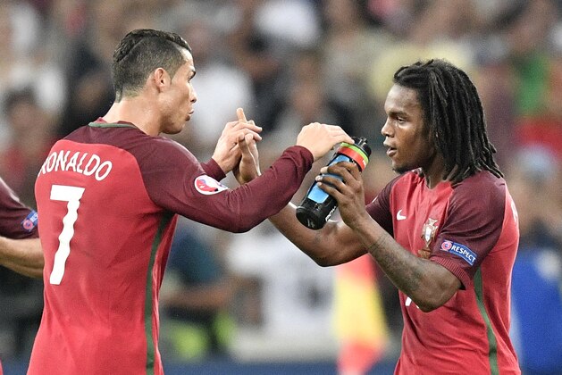 Portugal's Cristiano Ronaldo, left, congratulates Renato Sanches who scored their first goal during the Euro 2016 quarterfinal soccer match between Poland and Portugal, at the Velodrome stadium in Marseille, France, Thursday, June 30, 2016. (AP Photo/Martin Meissner)
