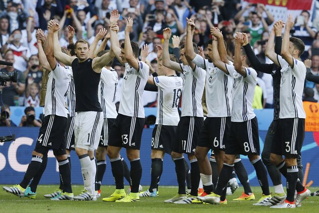 Players celebrate after the Euro 2016 round of 16 soccer match between Germany and Slovakia, at the Pierre Mauroy stadium in Villeneuve d'Ascq, near Lille, France, Sunday, June 26, 2016. (AP Photo/Michael Probst)