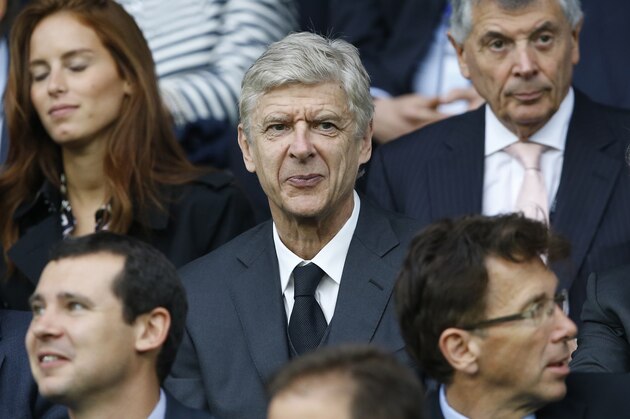 Arsenal coach Arsene Wenger watches from the stands during the Euro 2016 Group B soccer match between Slovakia and England at the Geoffroy Guichard stadium in Saint-Etienne, France, Monday, June 20, 2016. (AP Photo/Kirsty Wigglesworth)
