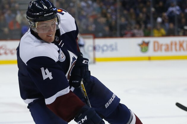 Colorado Avalanche defenseman Tyson Barrie takes a shot on goal against the Winnipeg Jets during the second period of an NHL hockey game Saturday, Nov. 28, 2015, in Denver. (AP Photo/Jack Dempsey)