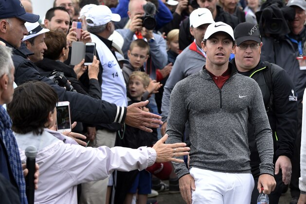 Northern Irish Rory McIlroy  arrives at the 1st tee during the second round of the 100th French Golf Open on July 1, 2016 at Le Golf National in Guyancourt, near Paris. / AFP / DOMINIQUE FAGET        (Photo credit should read DOMINIQUE FAGET/AFP/Getty Images)
