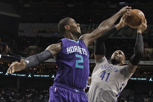 Charlotte Hornets' Marvin Williams (2) blocks a shot by Brooklyn Nets' Thomas Robinson (41) in the second half of an NBA basketball game in Charlotte, N.C., Friday, April 8, 2016. The Hornets won 113-99. (AP Photo/Chuck Burton)