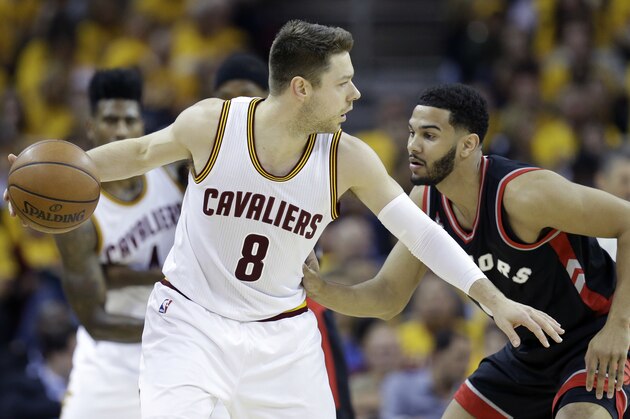 Cleveland Cavaliers' Matthew Dellavedova (8) looks to drive on Toronto Raptors' Cory Joseph (6) during the first half of Game 1 of the NBA basketball Eastern Conference finals, Tuesday, May 17, 2016, in Cleveland. (AP Photo/Tony Dejak)