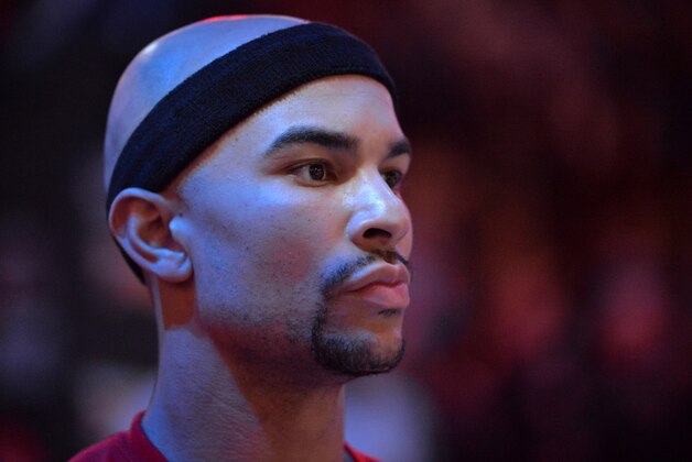 Milwaukee Bucks guard Jerryd Bayless stands on the court during the singing of the national anthem before an NBA basketball game Thursday, Jan. 28, 2016, in Memphis, Tenn. (AP Photo/Brandon Dill)