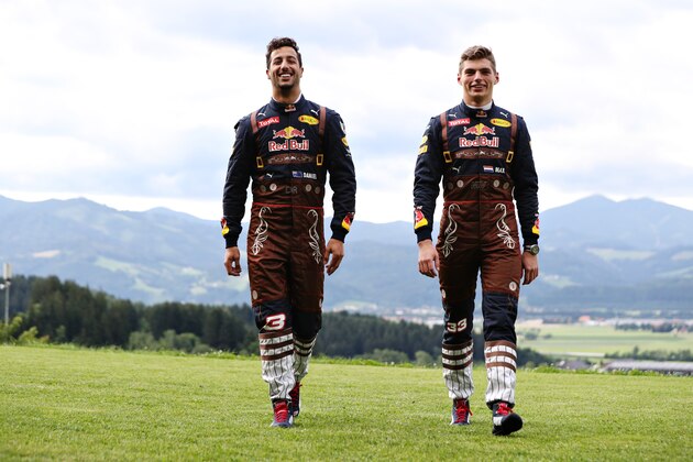 SPIELBERG, AUSTRIA - JUNE 30:  Daniel Ricciardo of Australia and Red Bull Racing and Max Verstappen of Netherlands and Red Bull Racing in their lederhosen themed race suits during previews ahead of the Formula One Grand Prix of Austria at Red Bull Ring on June 30, 2016 in Spielberg, Austria.  (Photo by Mark Thompson/Getty Images)