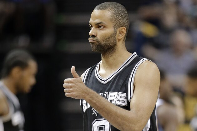 San Antonio Spurs guard Tony Parker (9) gestures after scoring against the Memphis Grizzlies during the first half of Game 4 in a first-round NBA basketball playoff series Sunday, April 24, 2016, in Memphis, Tenn. (AP Photo/Mark Humphrey)