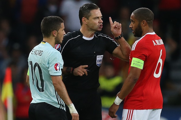Eden Hazard of Belgium, referee Damir Skomina , Ashley Williams of Wales during the UEFA EURO 2016 quarter final match between Wales and Belgium on July 2, 2016 at the Stade Pierre Mauroy in Lille, France.(Photo by VI Images via Getty Images)
