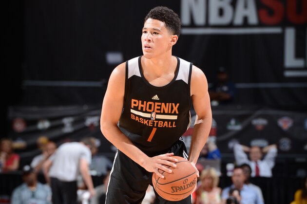 LAS VEGAS, NV - JULY 20:  Devin Booker #1 of the Phoenix Suns handles the ball against the San Antonio Spurs during the Las Vegas Summer League Championship on July 20, 2015 at the Thomas & Mack Center in Las Vegas, Nevada. NOTE TO USER: User expressly acknowledges and agrees that, by downloading and or using this photograph, User is consenting to the terms and conditions of the Getty Images License Agreement. Mandatory Copyright Notice: Copyright 2015 NBAE  (Photo by Garrett Ellwood/NBAE via Getty Images)