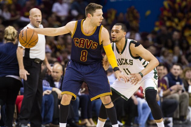 CLEVELAND, OH - MARCH 23: Matthew Dellavedova #8 of the Cleveland Cavaliers looks for a play while under pressure from Tyler Ennis #11 of the Milwaukee Bucks during the first half at Quicken Loans Arena on March 23, 2016 in Cleveland, Ohio. NOTE TO USER: User expressly acknowledges and agrees that, by downloading and/or using this photograph, user is consenting to the terms and conditions of the Getty Images License Agreement. Mandatory copyright notice. (Photo by Jason Miller/Getty Images)