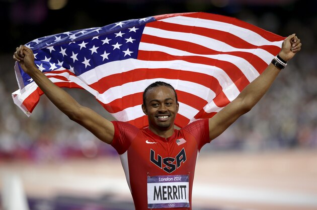 Aries Merritt celebrates winning the men's 100-meter hurdle at the 2012 Olympics in London.
